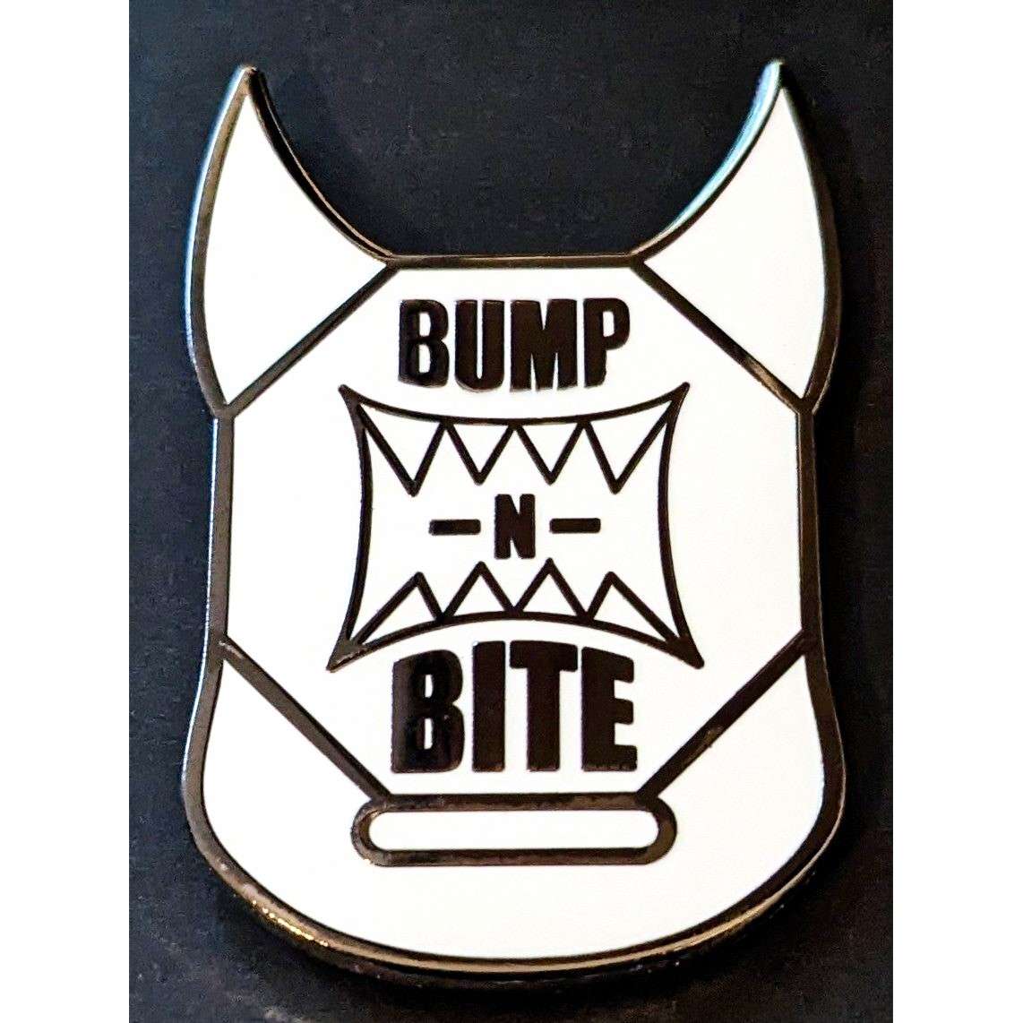 Bump-N-Bite LOGO PIN #6 White & Black Open Edition w/ White Glow Variant Chase Chance